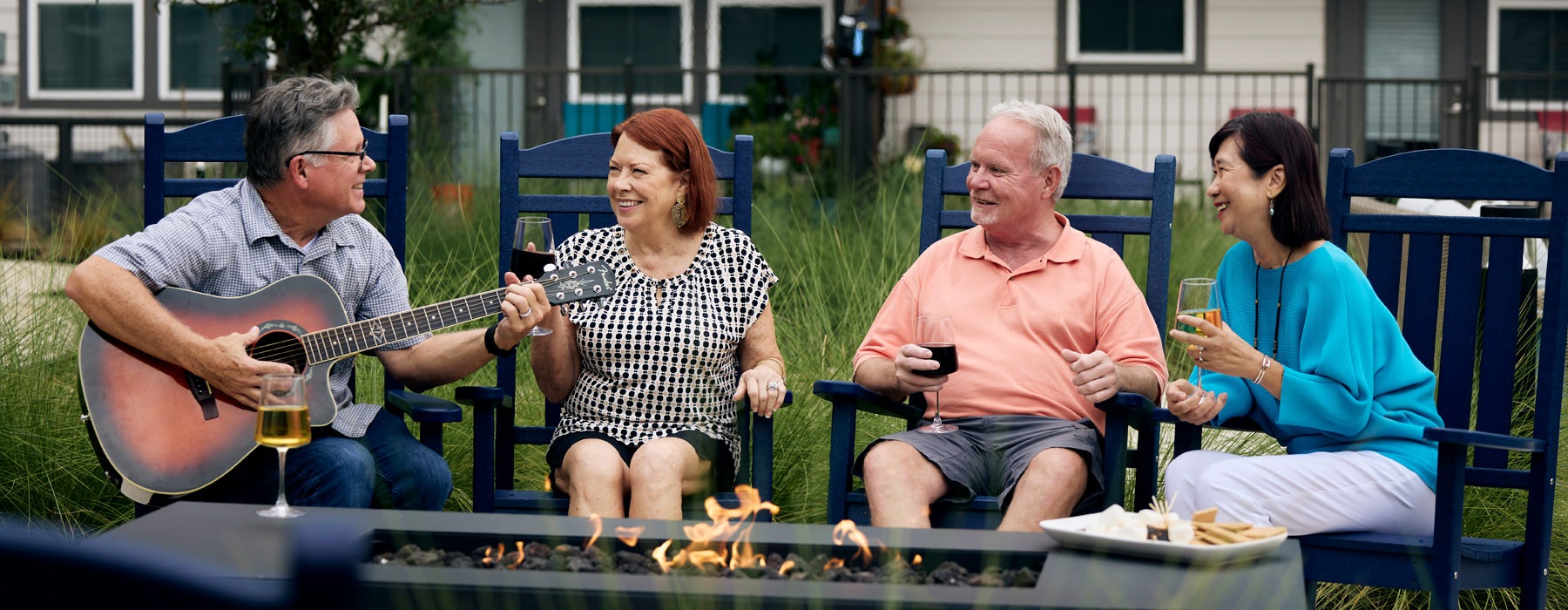 people sitting around campfire